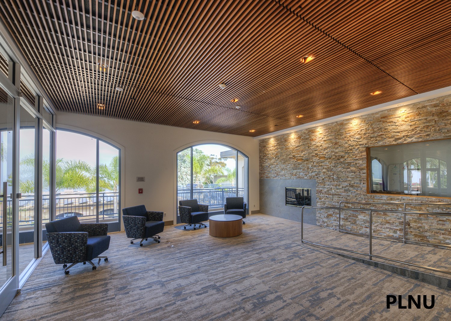 Wood slat ceiling in a light-filled PLNU campus interior